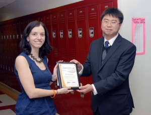 Newegg's Kevin Lee presenting Andrea with her award